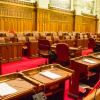 The senate chamber with empty seats and the red carpet.